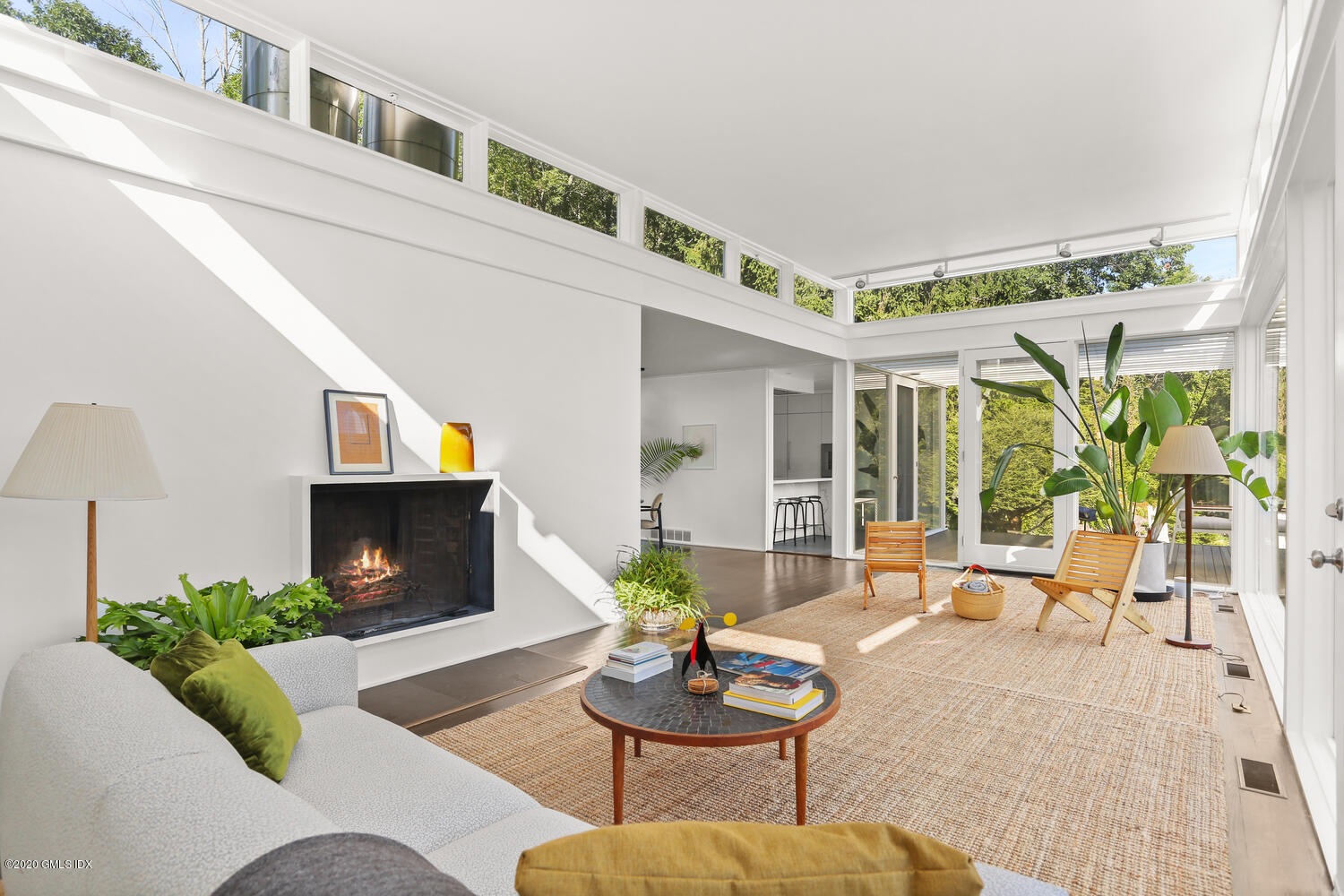 26 Chalburn Road Redding, CT 06896 - Photo 6 of 19 a living room with furniture a fireplace and a table