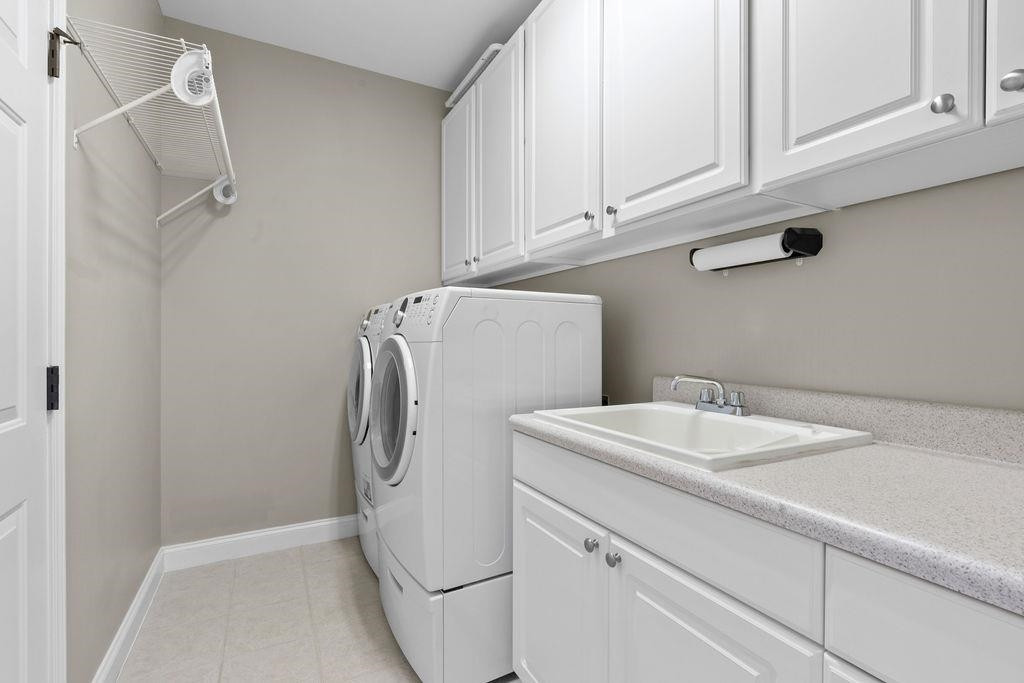 10702 Longholme Way Raleigh, NC 27614 - Photo 26 of 57 Large Laundry with Sink and Cabinets