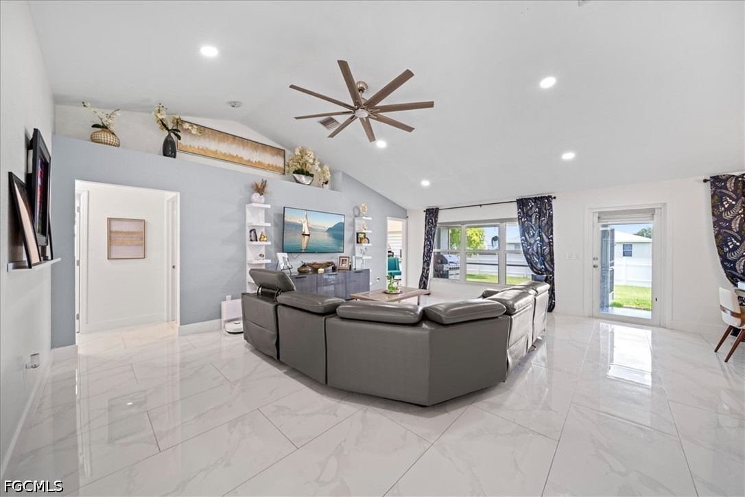 22 Nelson Road South Cape Coral, FL 33991 - Photo 10 of 43 a living room with furniture and a large window