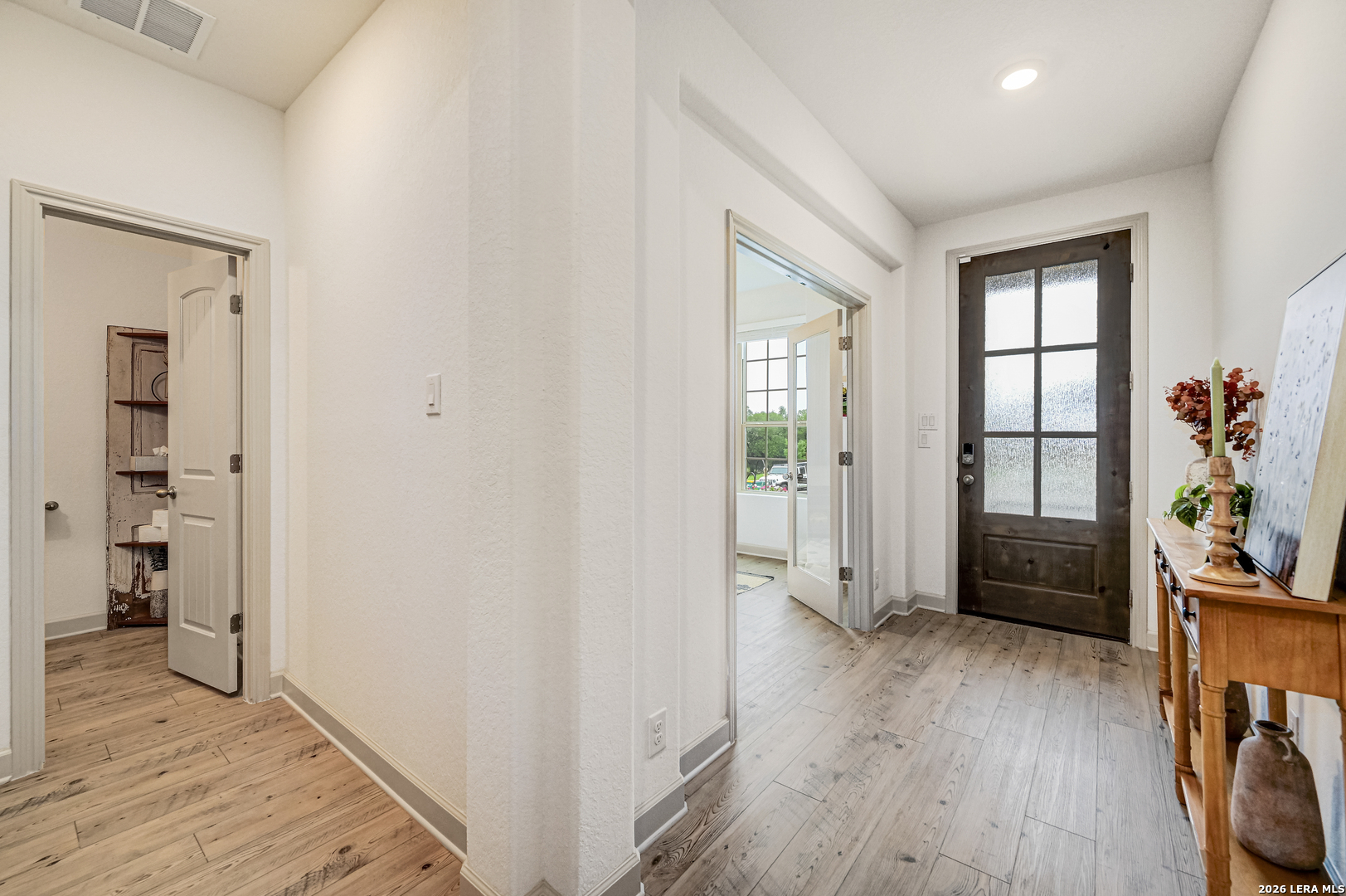 110 Breamoor Boerne, TX 78015 - Photo 16 of 38 wooden floor and windows in a room