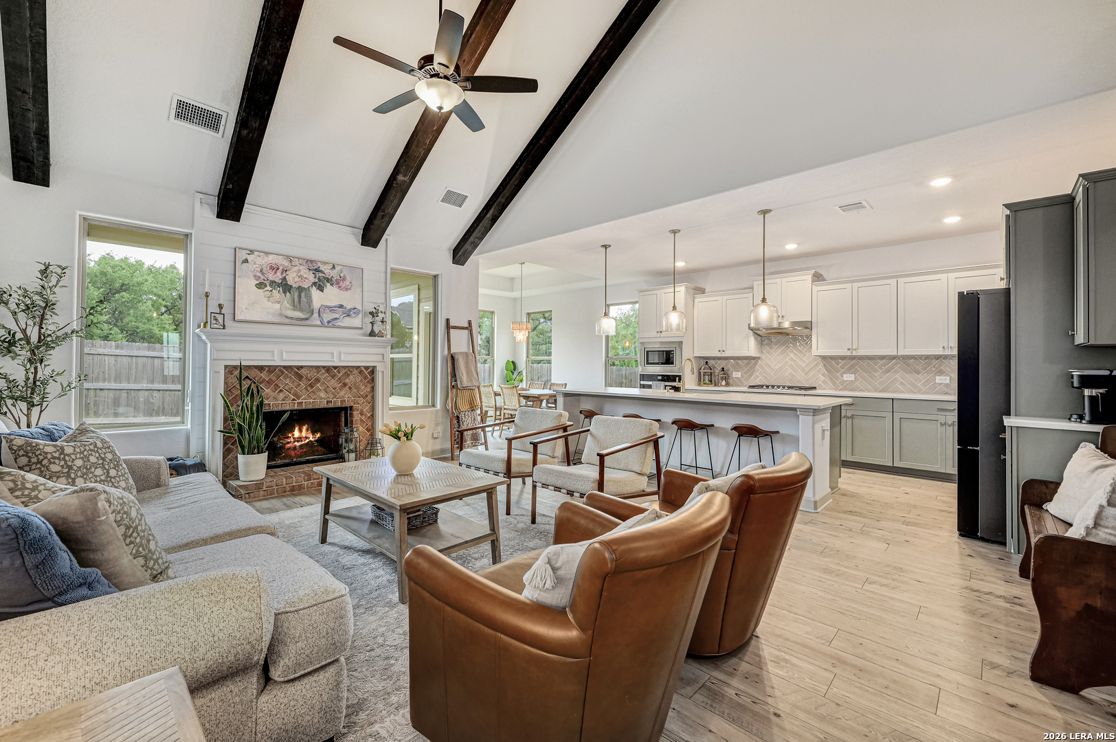 110 Breamoor Boerne, TX 78015 - Photo 2 of 38 a living room with furniture a fireplace and a flat screen tv