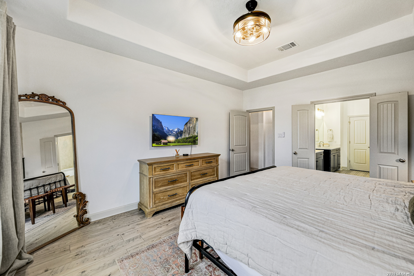 110 Breamoor Boerne, TX 78015 - Photo 22 of 38 a bedroom with a bed and a dresser in it
