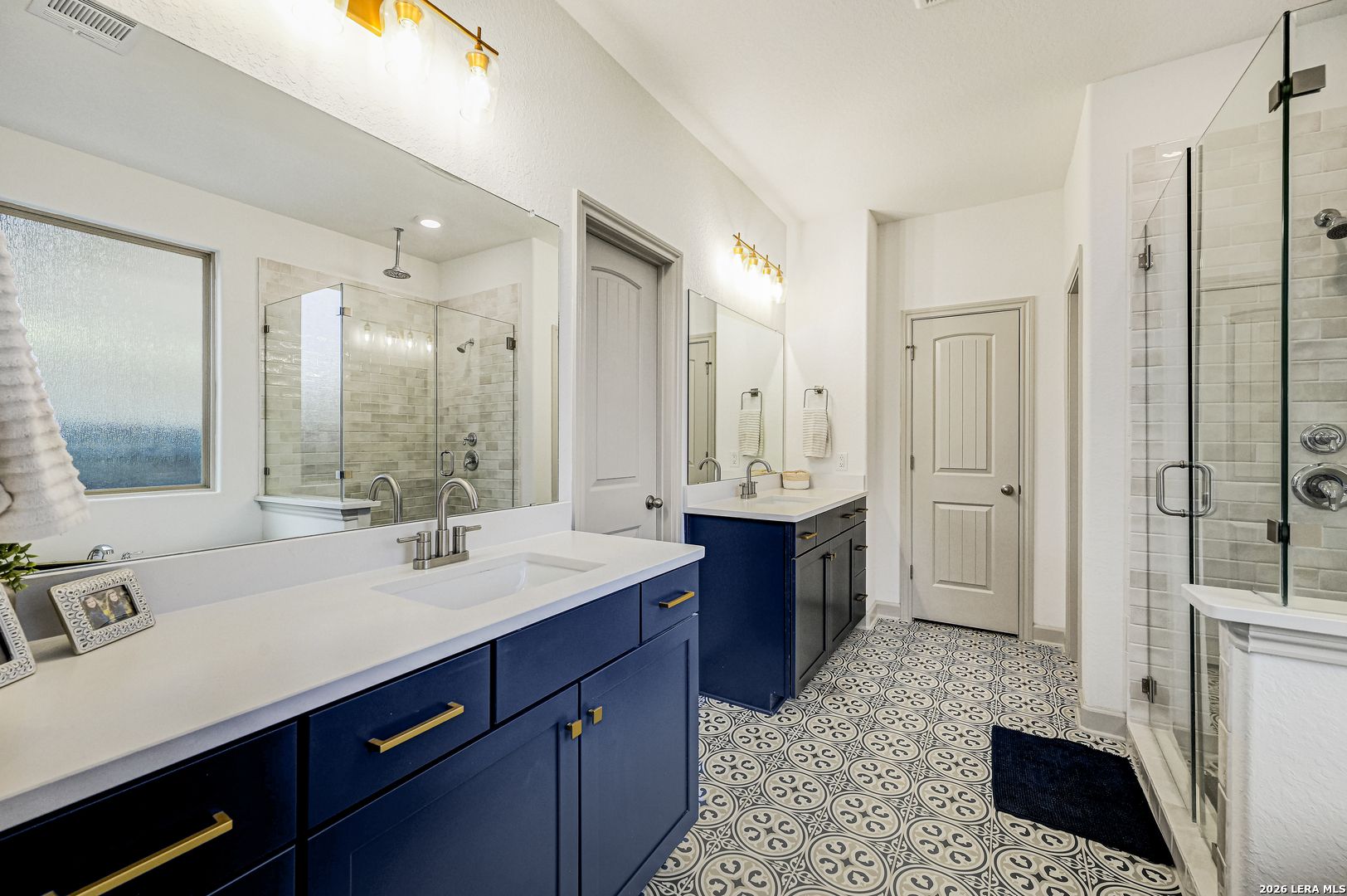 110 Breamoor Boerne, TX 78015 - Photo 23 of 38 a bath room with a sink double vanity and a mirror