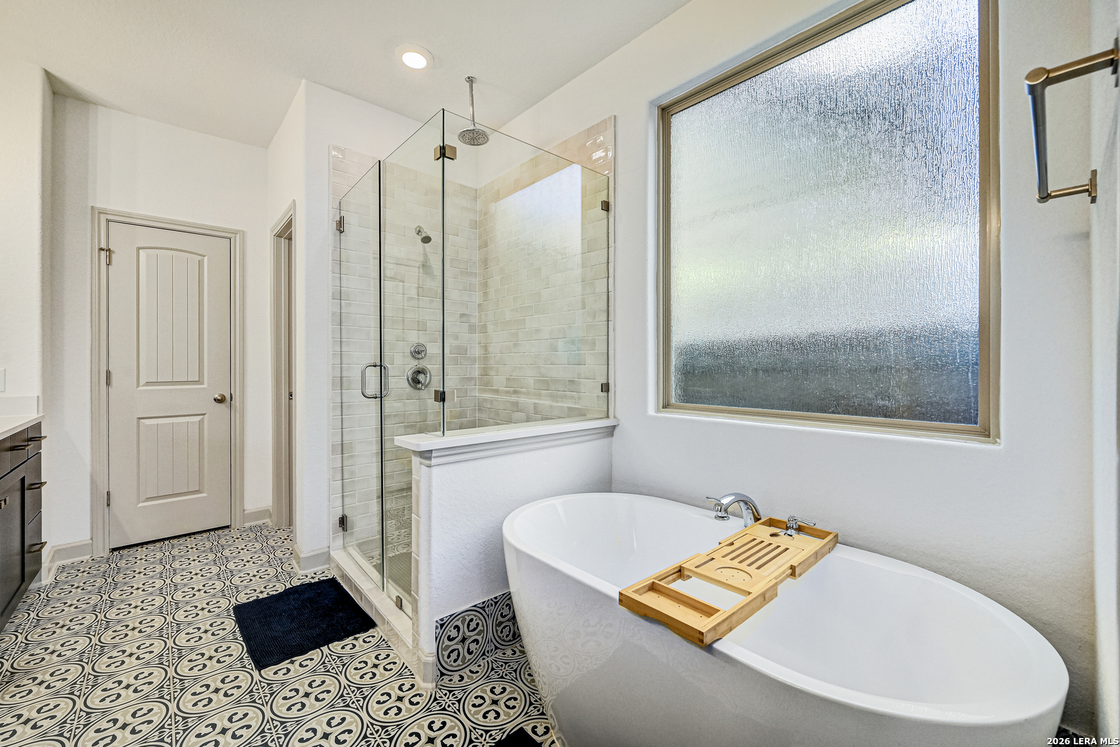 110 Breamoor Boerne, TX 78015 - Photo 24 of 38 a bathroom with a tub shower and sink