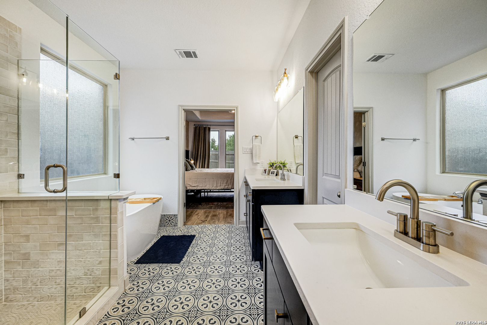 110 Breamoor Boerne, TX 78015 - Photo 25 of 38 a bathroom with a tub sink and mirror