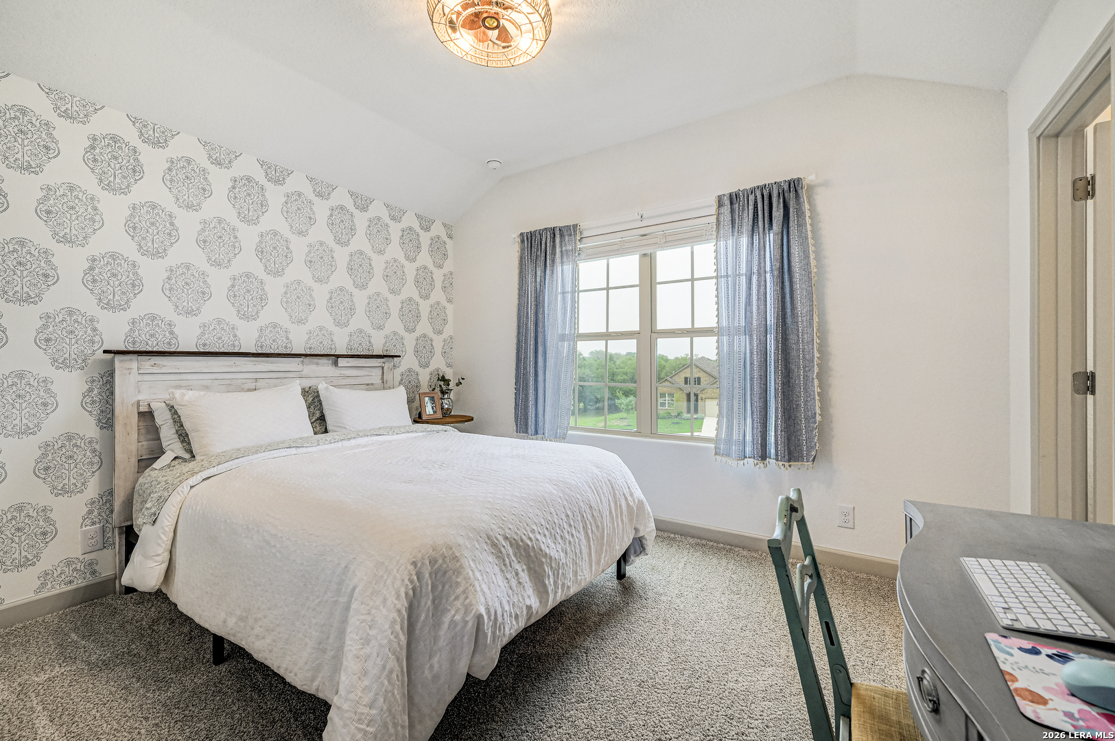 110 Breamoor Boerne, TX 78015 - Photo 29 of 38 a bed sitting in a bedroom next to a window