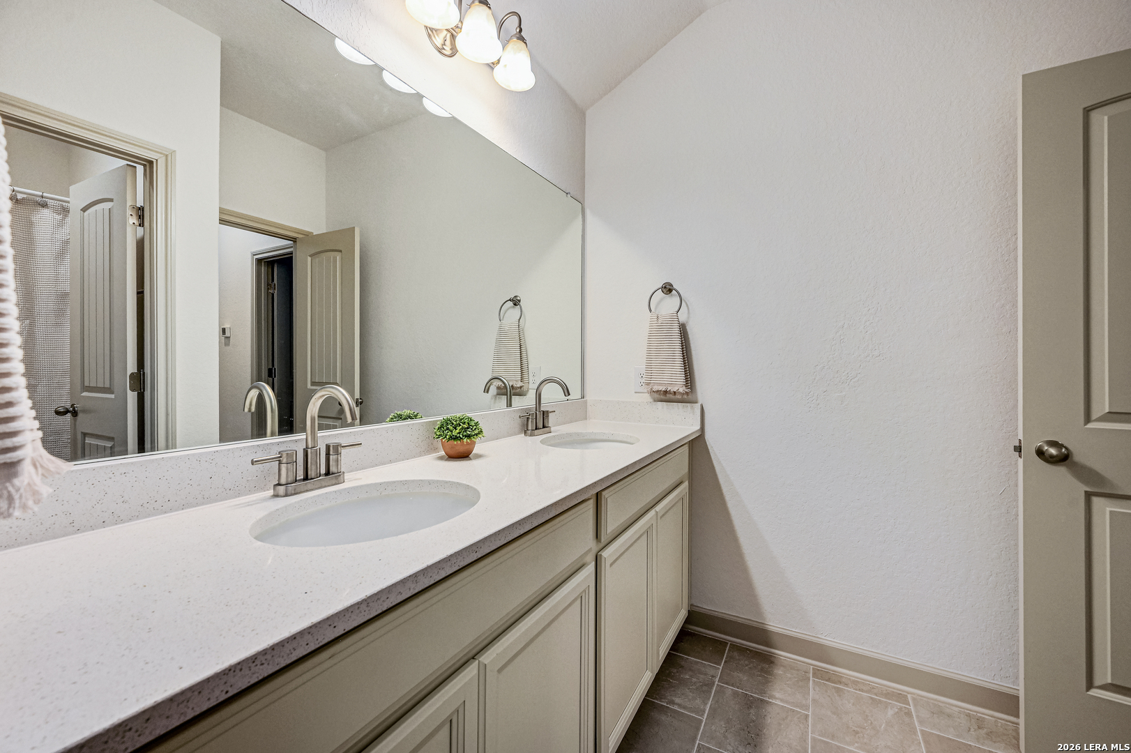 110 Breamoor Boerne, TX 78015 - Photo 33 of 38 a bathroom with a sink a vanity and a mirror
