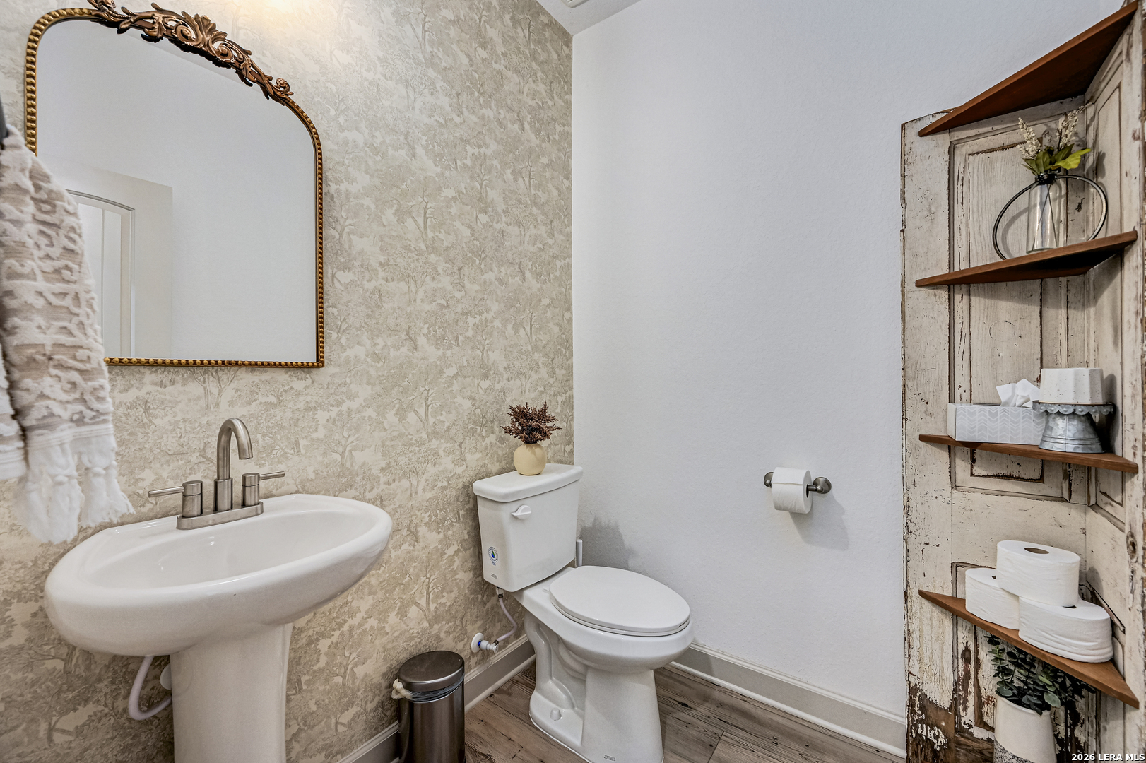110 Breamoor Boerne, TX 78015 - Photo 34 of 38 a bathroom with a toilet sink and mirror