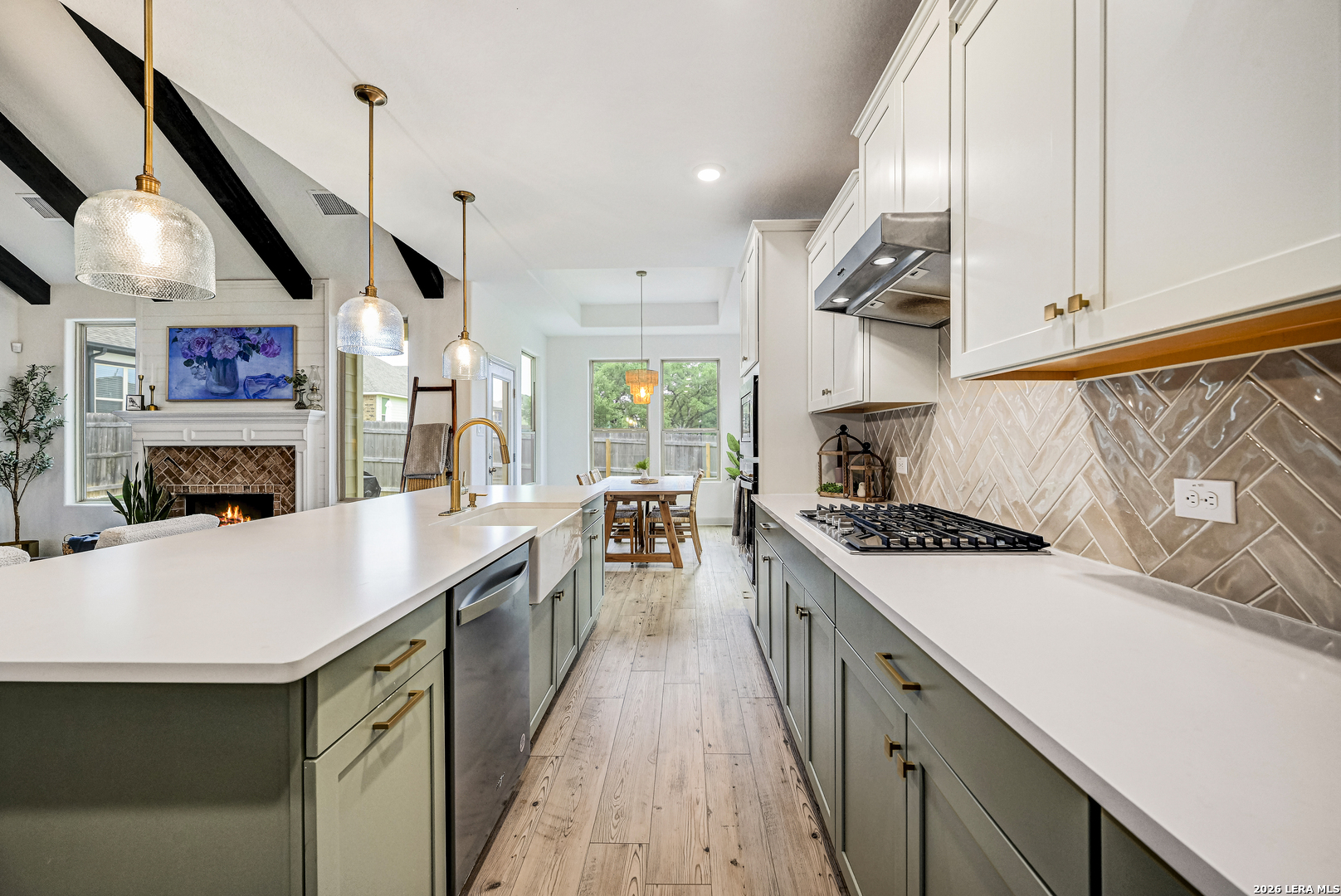110 Breamoor Boerne, TX 78015 - Photo 8 of 38 a kitchen with stainless steel appliances granite countertop a sink a stove and a wooden floors