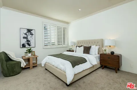 a view of a swimming pool with a lounge chair