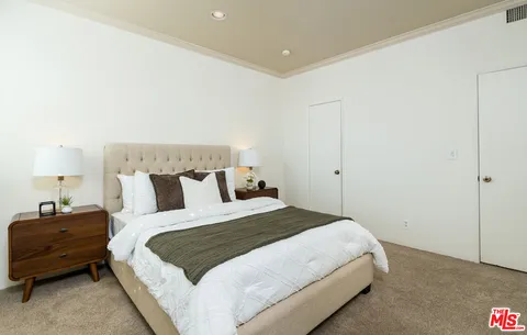 a house view with a seating space and swimming pool