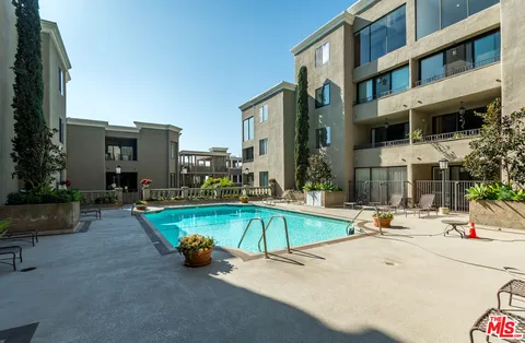 a view of pool with outdoor seating
