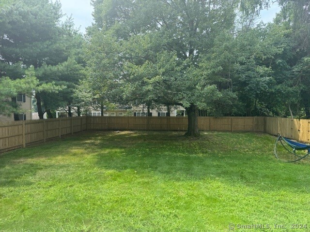 655 West Avenue, Unit BACK Milford, CT 06461 - Photo 18 of 18 a view of a backyard with large trees