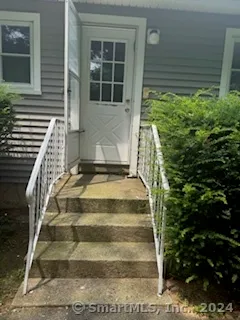 a view of statue in front of house