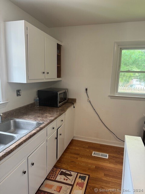 655 West Avenue, Unit BACK Milford, CT 06461 - Photo 4 of 18 a kitchen with a sink and cabinets