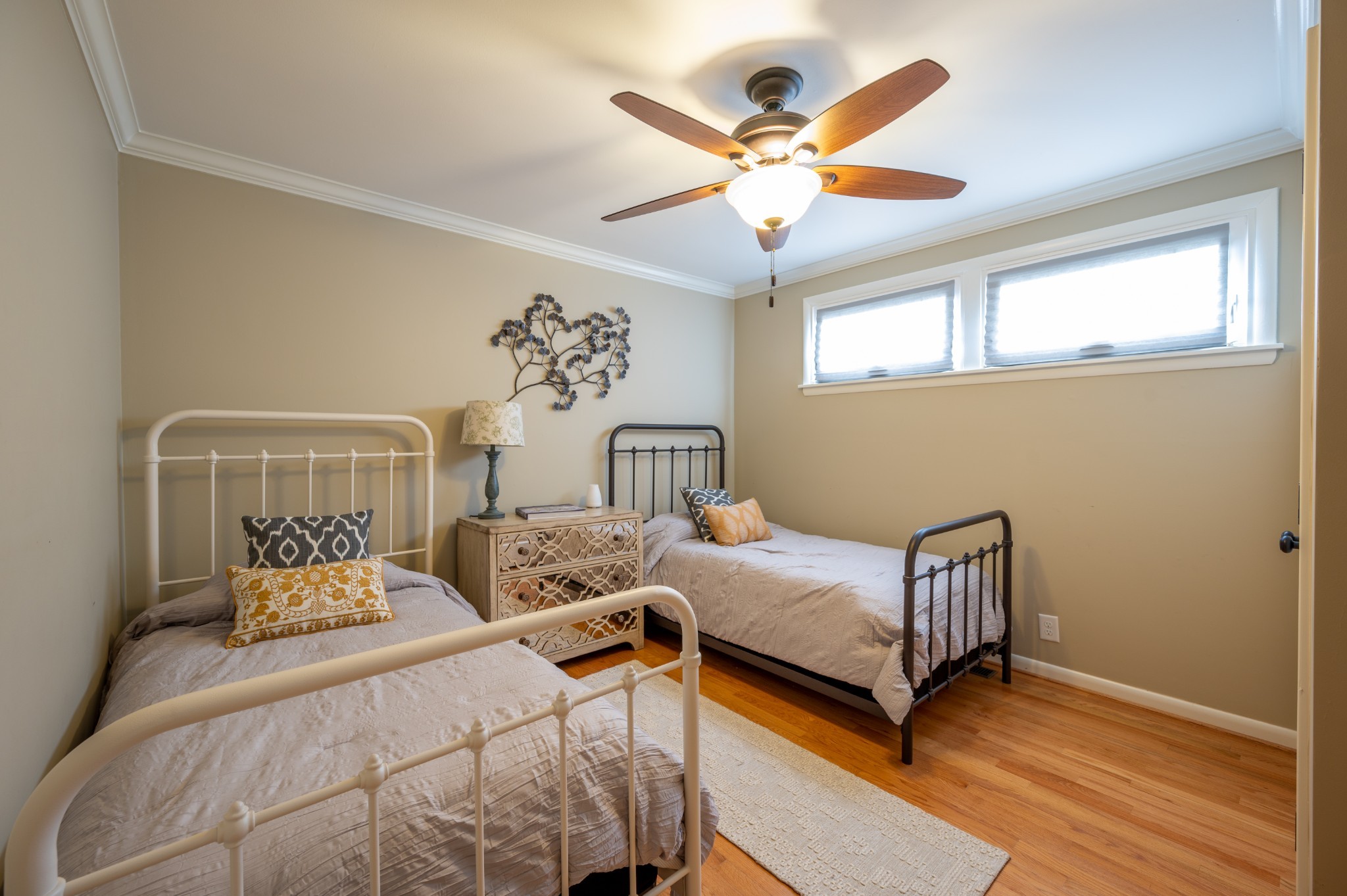1208 Davidson Road Nashville, TN 37205 - Photo 20 of 30 a bedroom with a bed and a chandelier