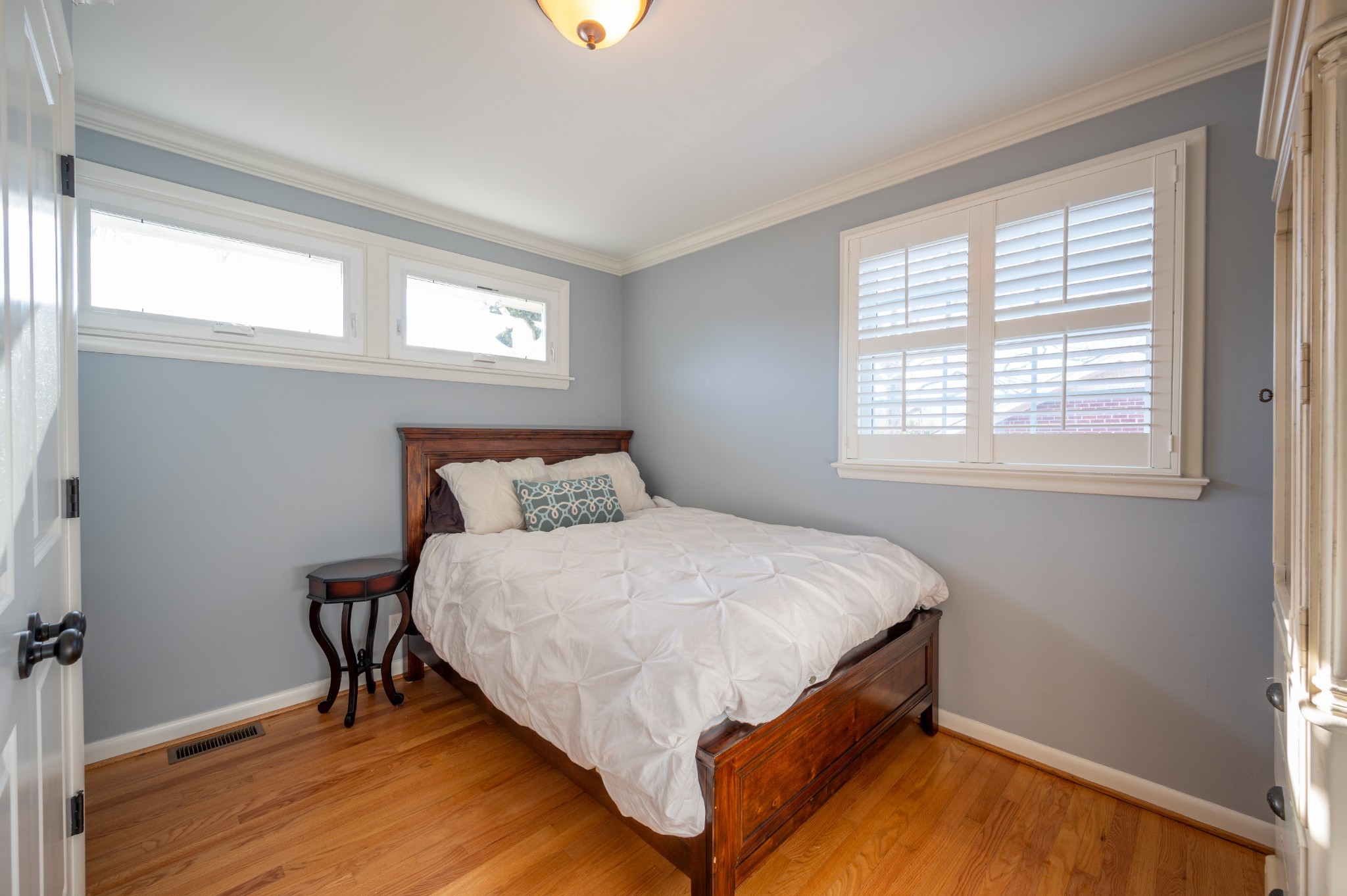 1208 Davidson Road Nashville, TN 37205 - Photo 21 of 30 a bed sitting in a bedroom next to a window