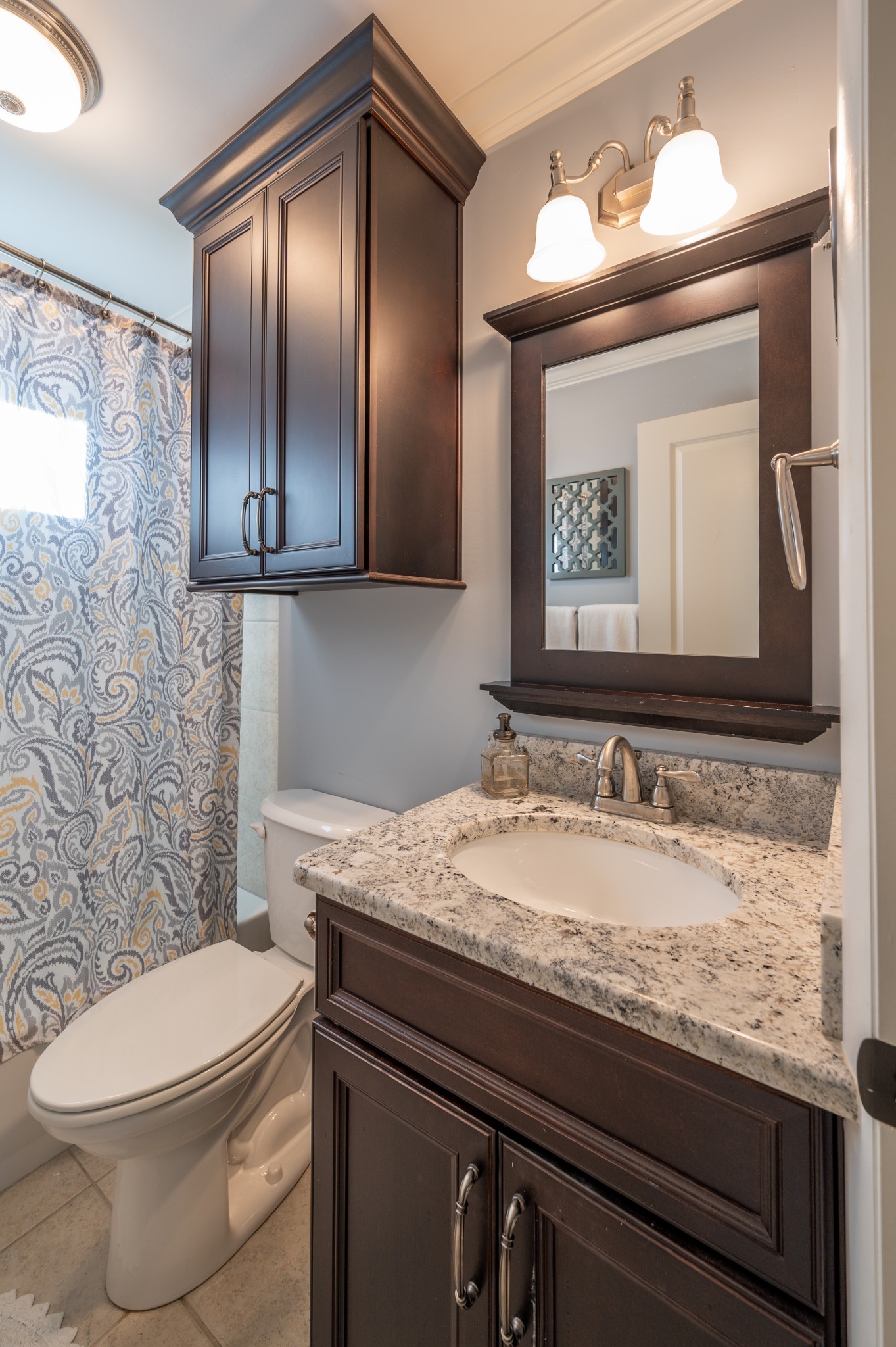 1208 Davidson Road Nashville, TN 37205 - Photo 22 of 30 a bathroom with a granite countertop toilet sink and mirror