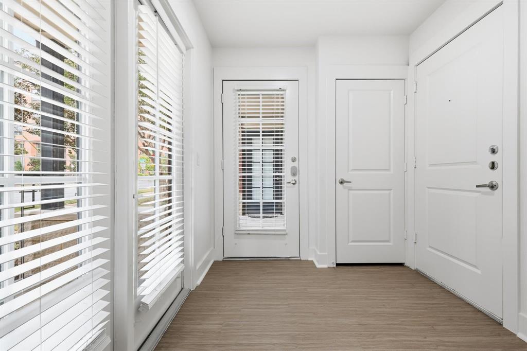 4110 Fairmount Street, Unit 1005 Dallas, TX 75219 - Photo 11 of 35 an empty room with windows