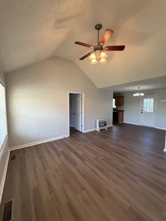 a kitchen with stainless steel appliances granite countertop a sink and a stove top oven