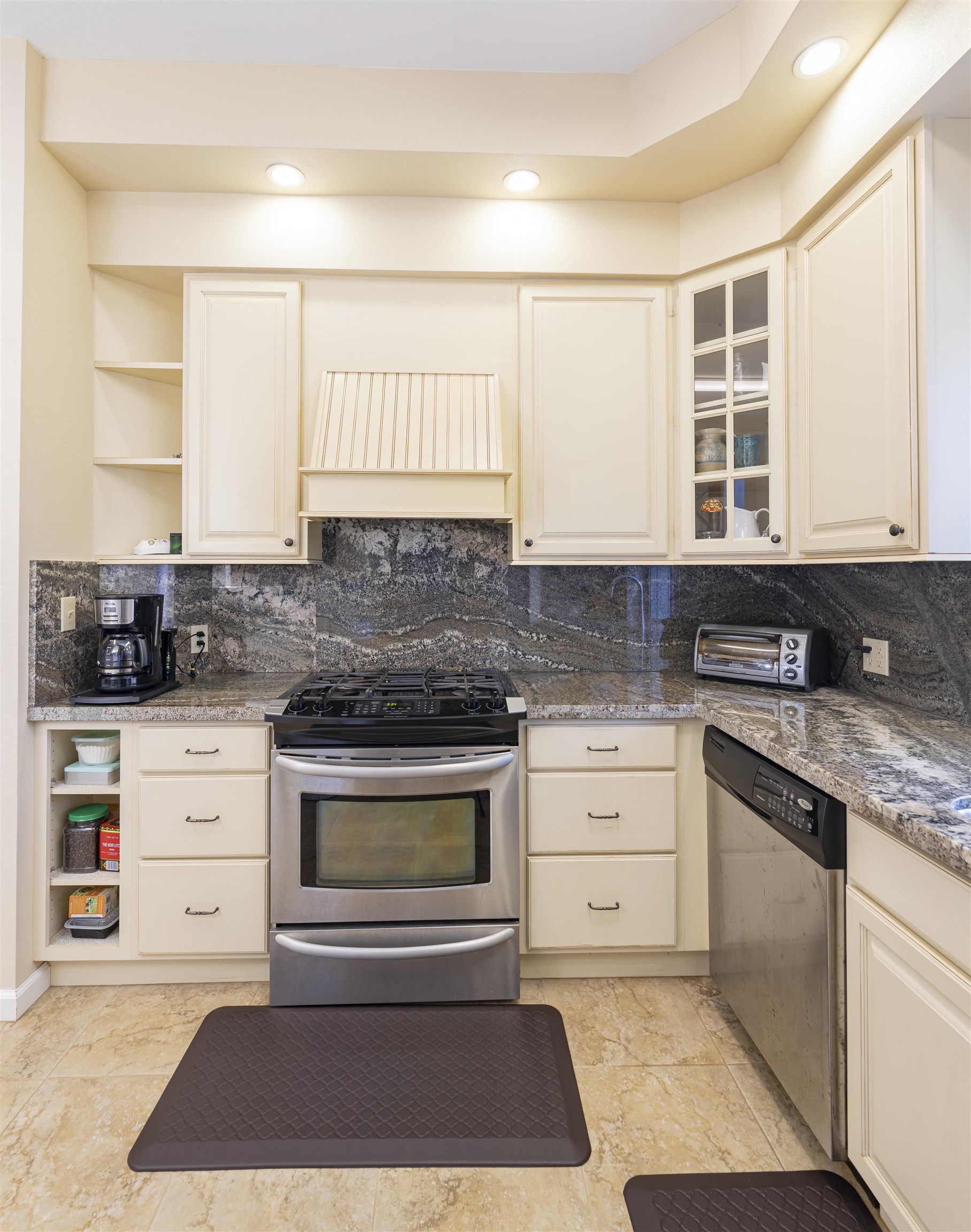 2936 Lower Kula Road Kula, HI 96790 - Photo 8 of 30 a kitchen with granite countertop a stove a sink and a microwave