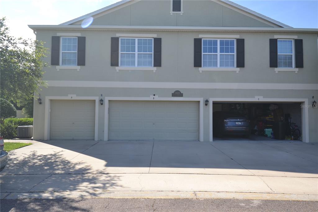 3609 Seneca Club Loop, Unit A Orlando, FL 32808 - Photo 1 of 1 a view of a house with a yard