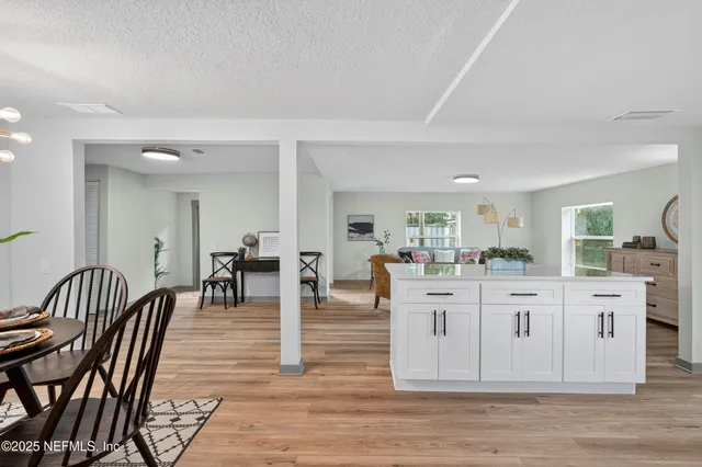 a bedroom with a bed and a night stand