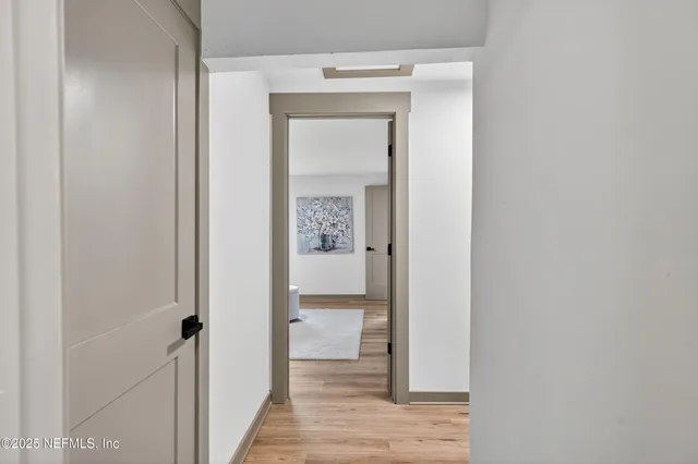 a view of balcony with wooden floor and fence