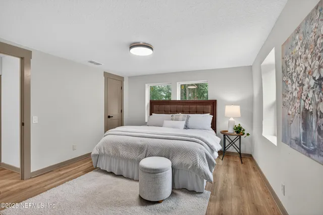 an aerial view of house with yard and seating space