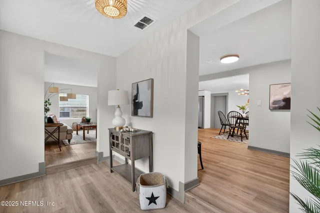 a room with furniture and wooden floor