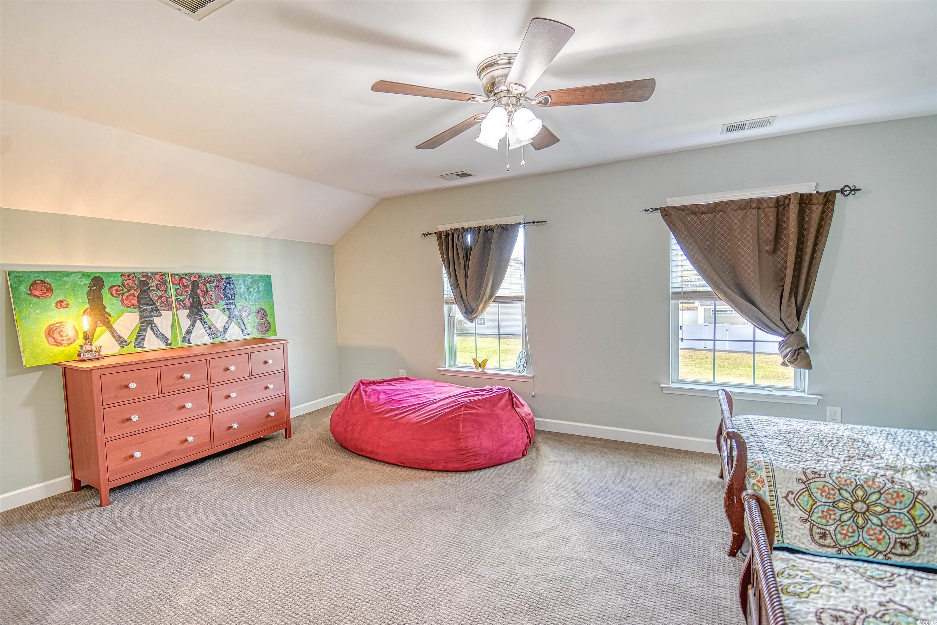 293 Ridge Point Drive Conway, SC 29526 - Photo 19 of 36 Bedroom featuring ceiling fan, vaulted ceiling, li