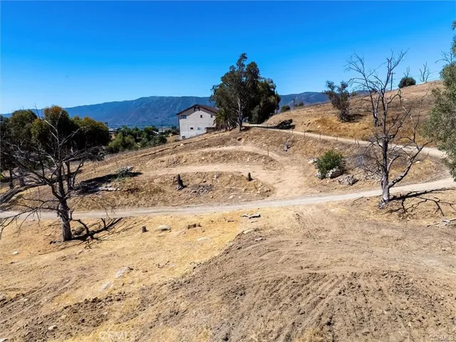 a view of a backyard of the house