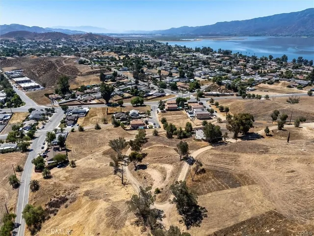 an aerial view of residential house and sandy dunes