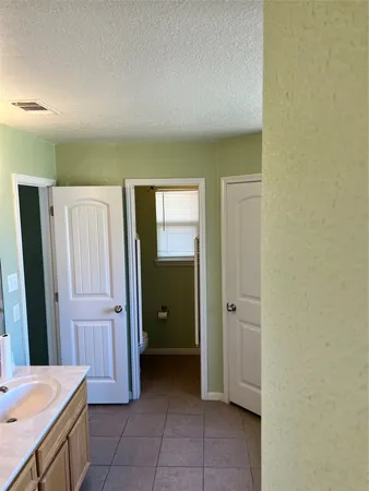a view of a hallway with closet area