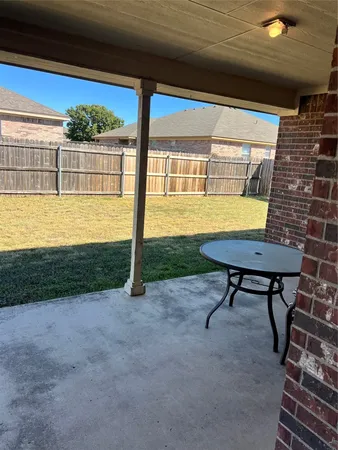 a view of a swimming pool with a yard