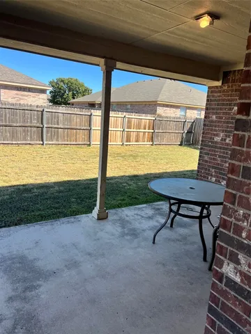 a view of a swimming pool with a yard