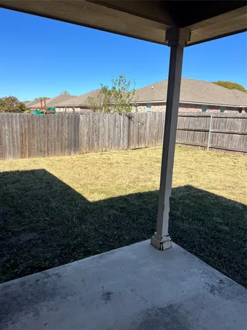 a view of a yard with an outdoor space