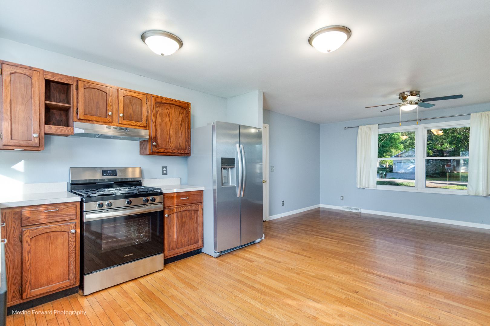 1907 Irene Road Sandwich, IL 60548 - Photo 9 of 25 a kitchen with stainless steel appliances granite countertop a stove a sink and a refrigerator