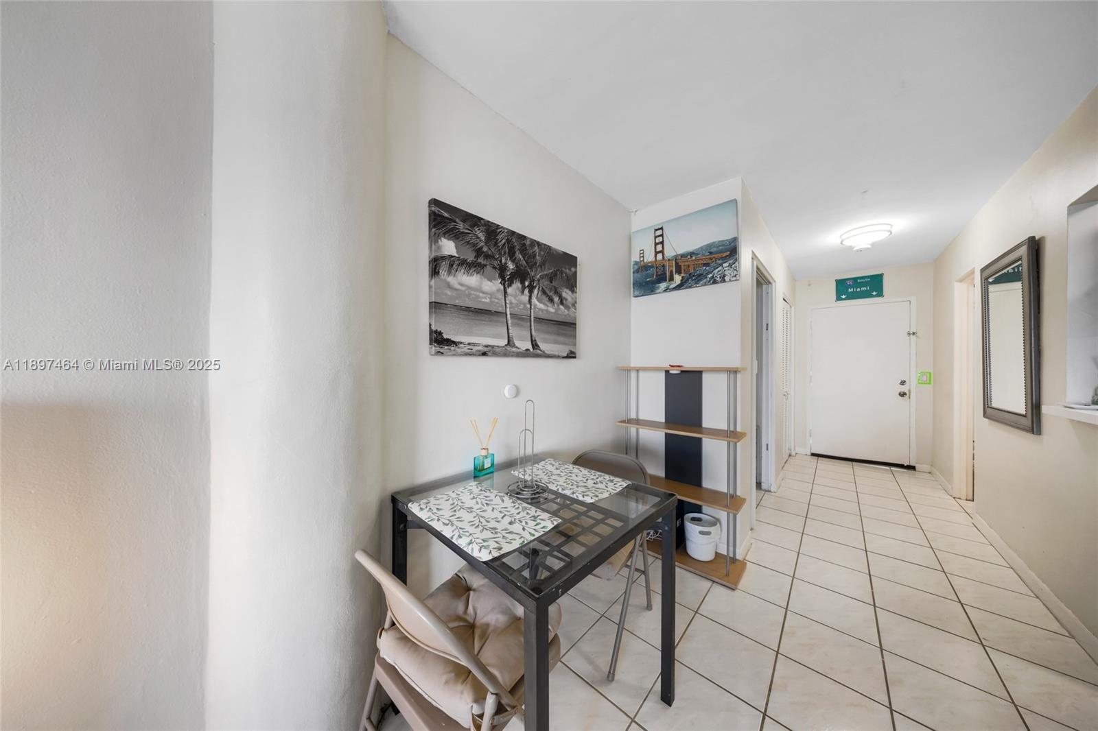 7904 West Drive, Unit 1010 North Bay Village, FL 33141 - Photo 11 of 25 a view of kitchen island with furniture and refrigerator