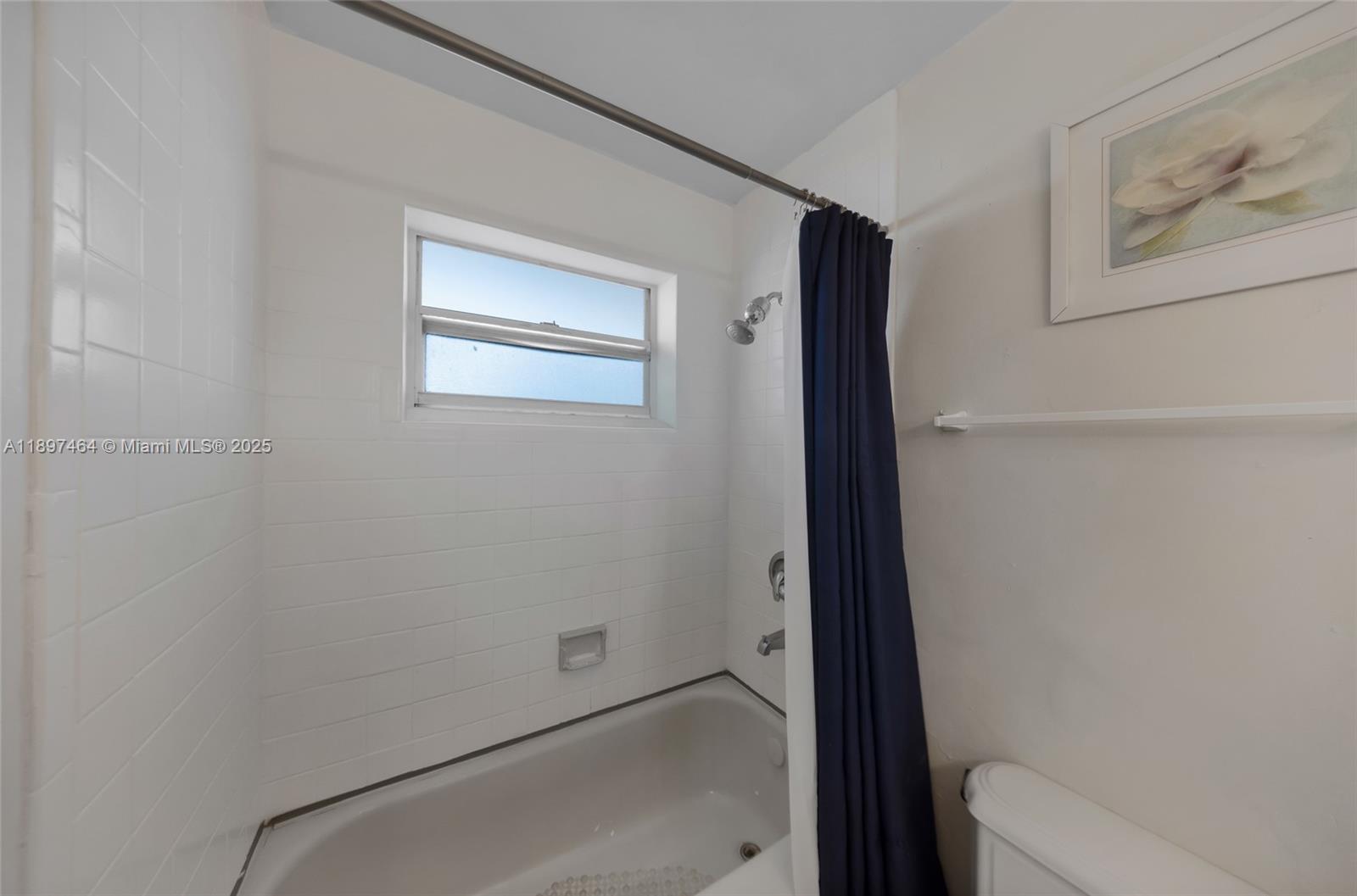 7904 West Drive, Unit 1010 North Bay Village, FL 33141 - Photo 15 of 25 a bathroom with a bathtub