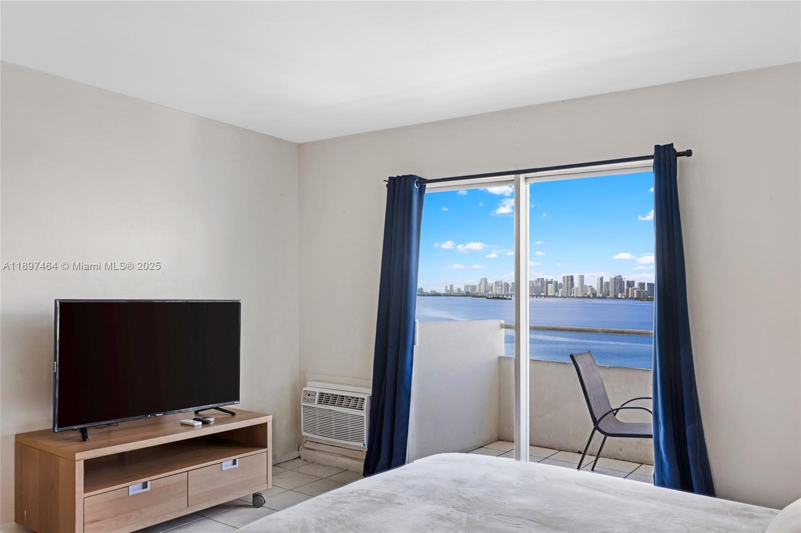 7904 West Drive, Unit 1010 North Bay Village, FL 33141 - Photo 2 of 25 a view of workspace with flat screen tv