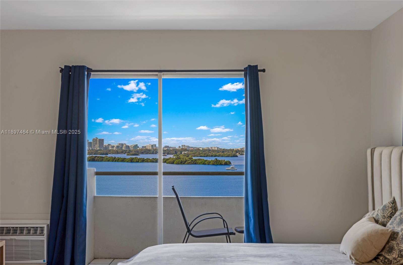 7904 West Drive, Unit 1010 North Bay Village, FL 33141 - Photo 21 of 25 a view of a room with a large window and furniture
