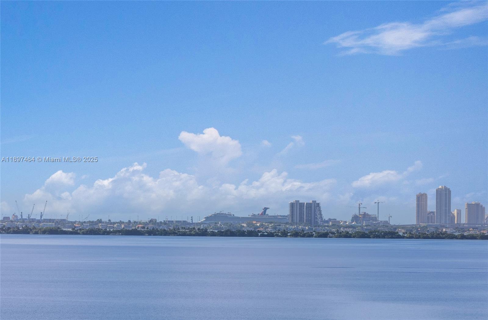 7904 West Drive, Unit 1010 North Bay Village, FL 33141 - Photo 23 of 25 a view of a lake and a building in the background