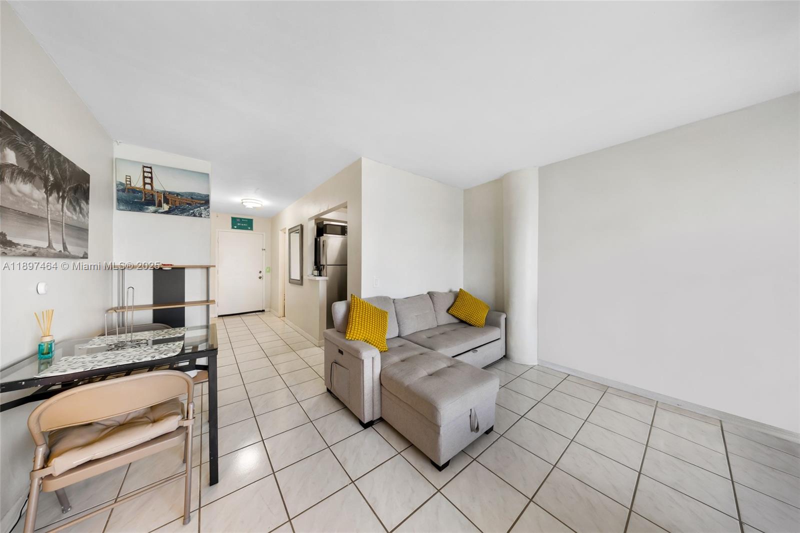 7904 West Drive, Unit 1010 North Bay Village, FL 33141 - Photo 8 of 25 a living room with furniture and a table