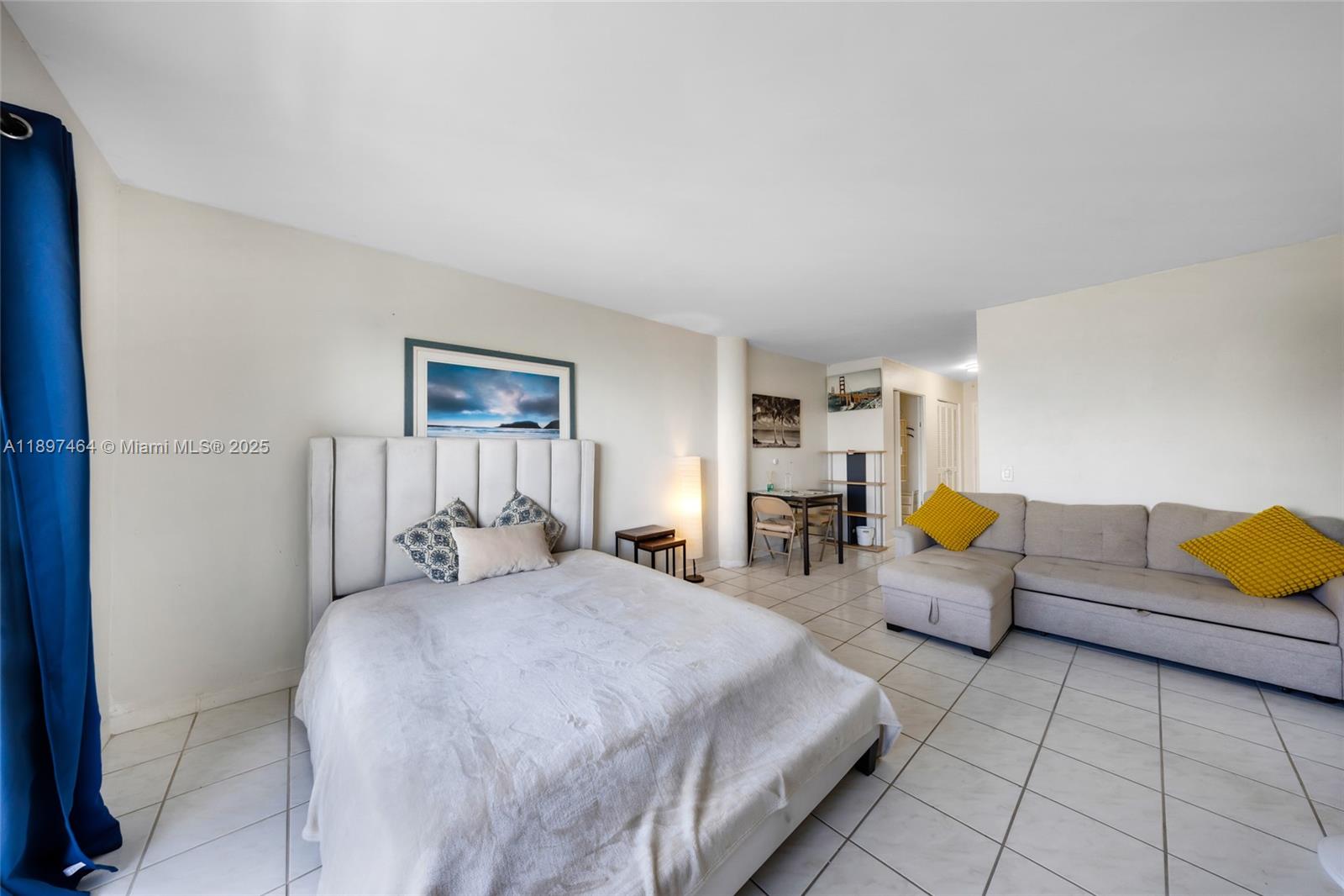 7904 West Drive, Unit 1010 North Bay Village, FL 33141 - Photo 9 of 25 a bedroom with bed and couch