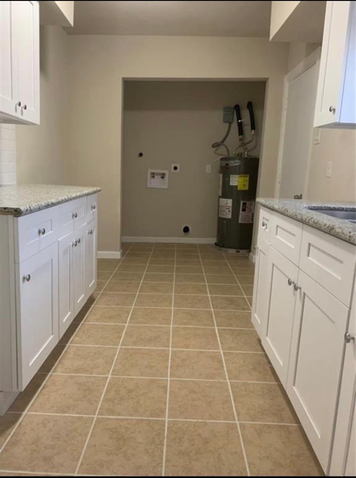 324 Delaware Street, Unit B Houston, TX 77029 - Photo 4 of 15 a room with kitchen countertops and cabinets