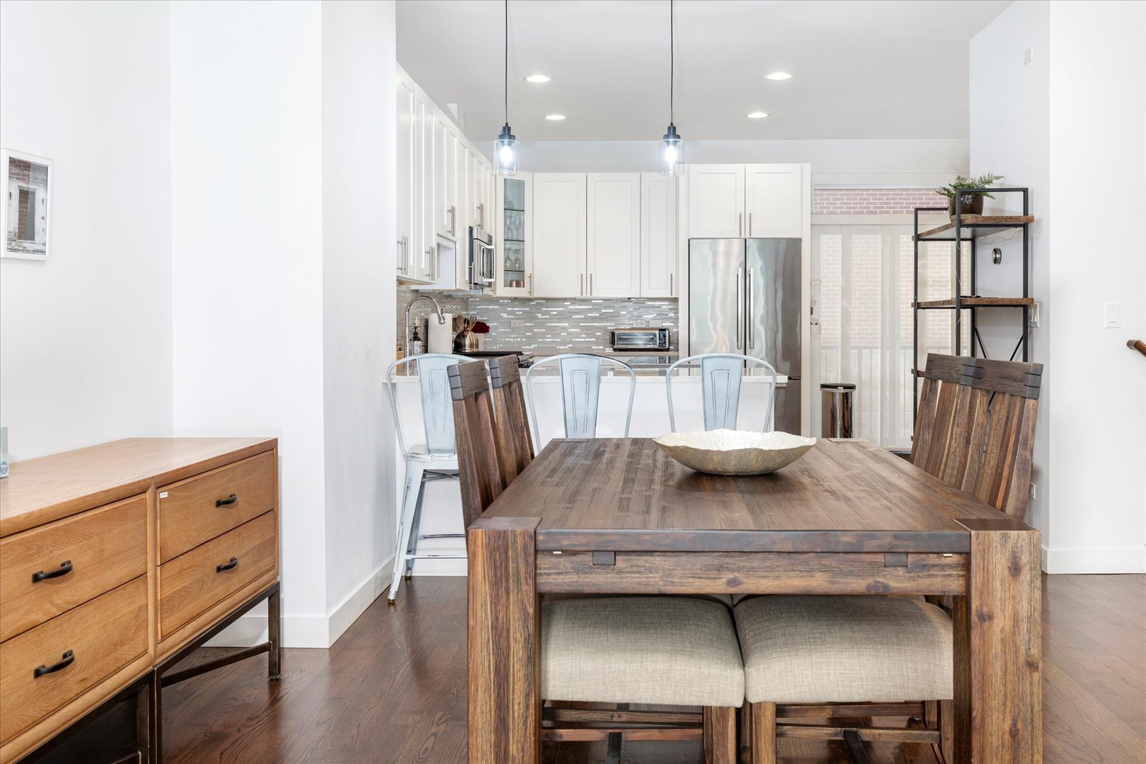 103 Home Avenue Oak Park, IL 60302 - Photo 12 of 33 a kitchen with a table chairs refrigerator and microwave