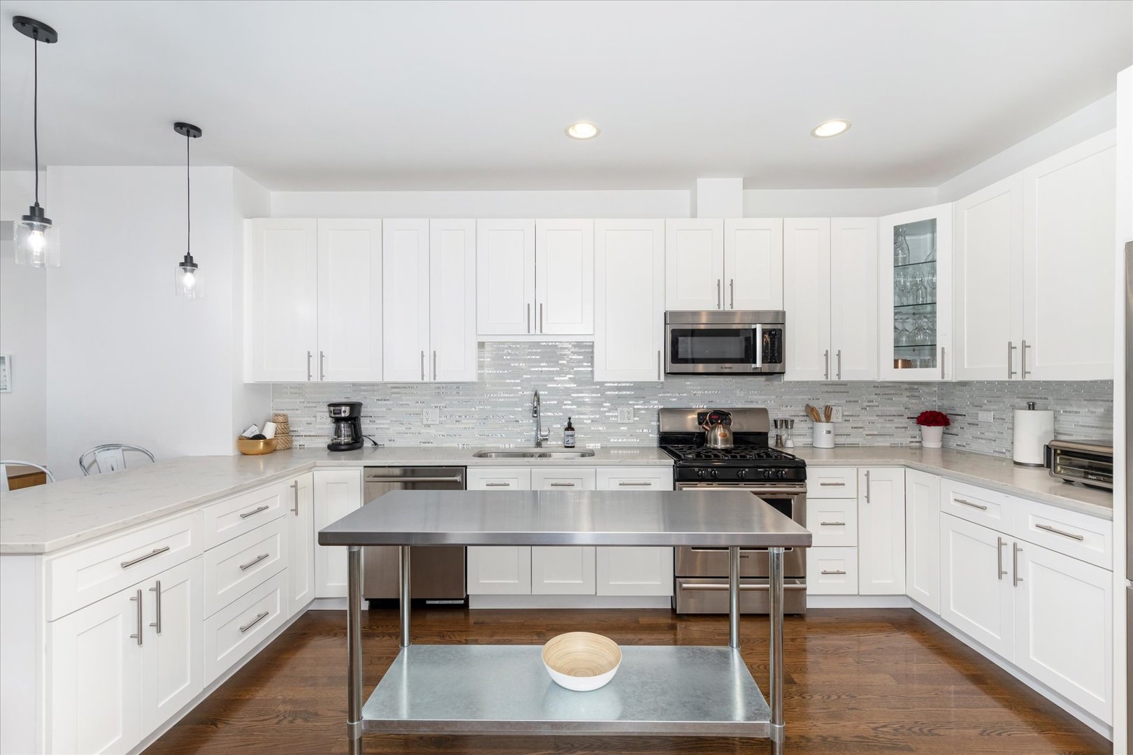 103 Home Avenue Oak Park, IL 60302 - Photo 15 of 33 a kitchen with stainless steel appliances granite countertop a stove a sink and white cabinets