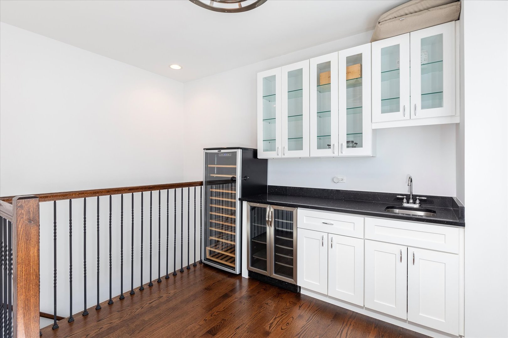 103 Home Avenue Oak Park, IL 60302 - Photo 26 of 33 a kitchen with granite countertop white cabinets and sink