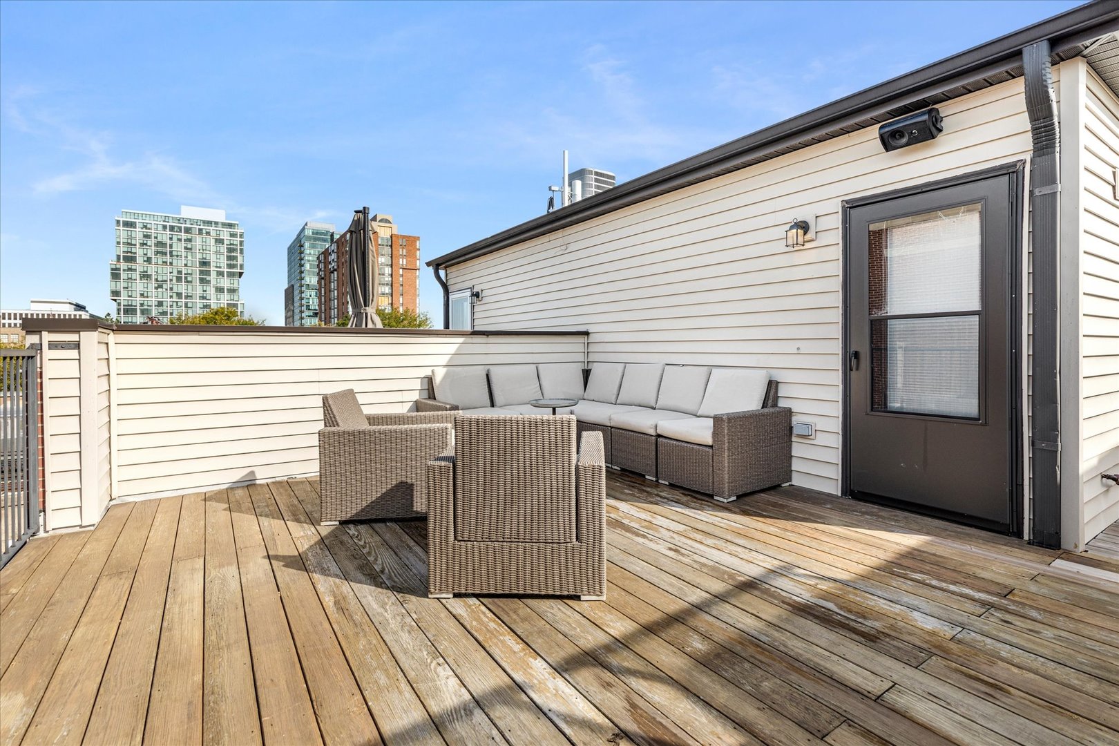 103 Home Avenue Oak Park, IL 60302 - Photo 28 of 33 a view of a roof deck with wooden floor and seating space
